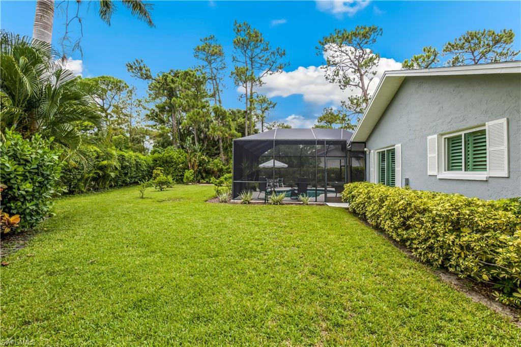 2232 Buckingham Lane Naples, FL 34112 - Photo 28 of 30 a view of a house with a garden