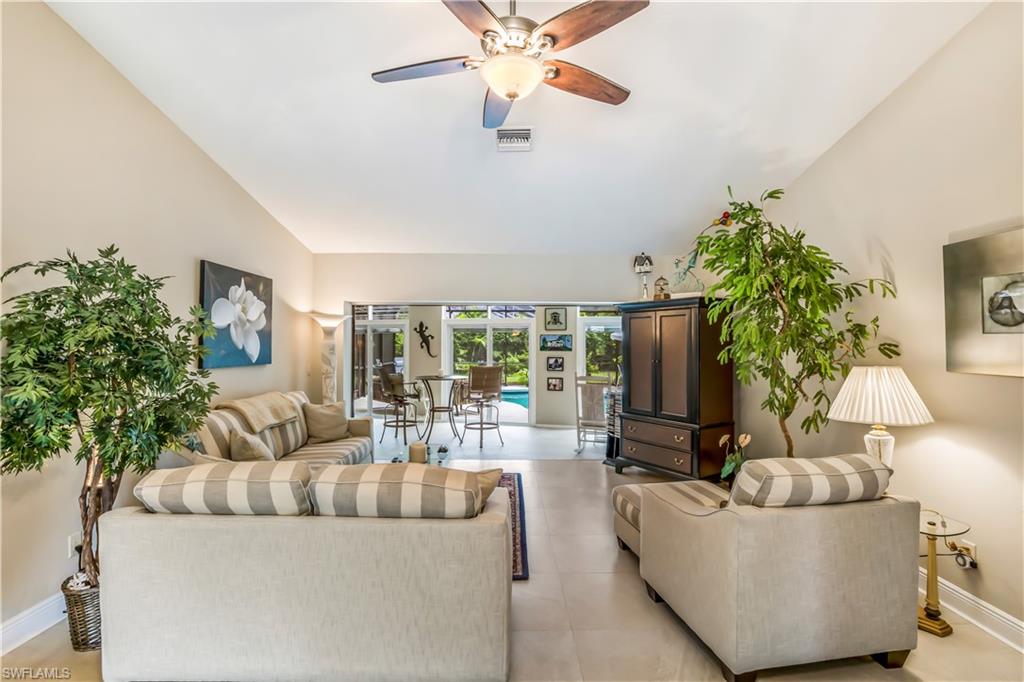 2232 Buckingham Lane Naples, FL 34112 - Photo 5 of 30 a living room with furniture and a large window