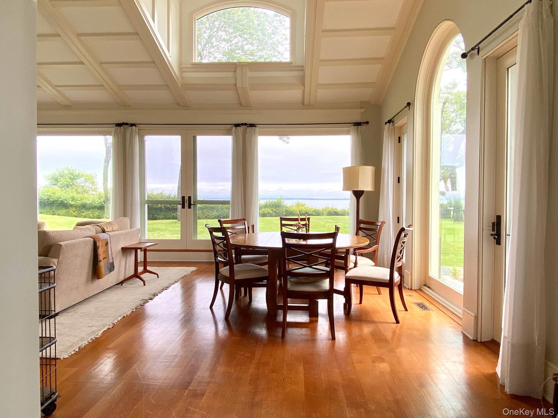 2840 Stars Road East Marion, NY 11939 - Photo 9 of 18 Sunroom featuring french doors, visible vents, and beamed ceiling