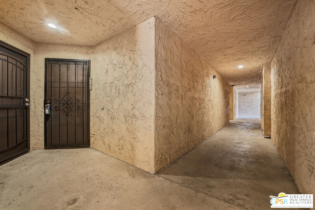 a view of a hallway with closet area