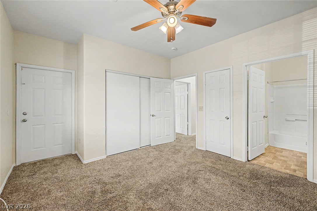 4730 East Craig Road, Unit 1091 Las Vegas, NV 89115 - Photo 15 of 23 Plush carpeting anchors this comfortable bedroom complete with an attached private bathroom.