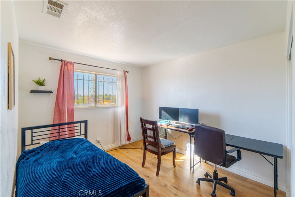 16403 Seneca Road Victorville, CA 92395 - Photo 18 of 47 a view of a workspace with furniture and a window