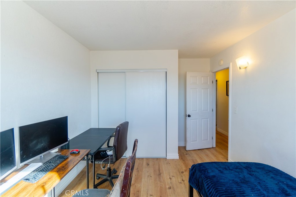 16403 Seneca Road Victorville, CA 92395 - Photo 19 of 47 a workspace with furniture and wooden floor