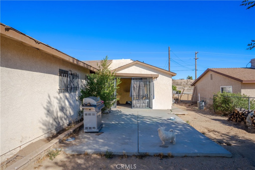 16403 Seneca Road Victorville, CA 92395 - Photo 29 of 47 a view of a house with backyard and sitting area