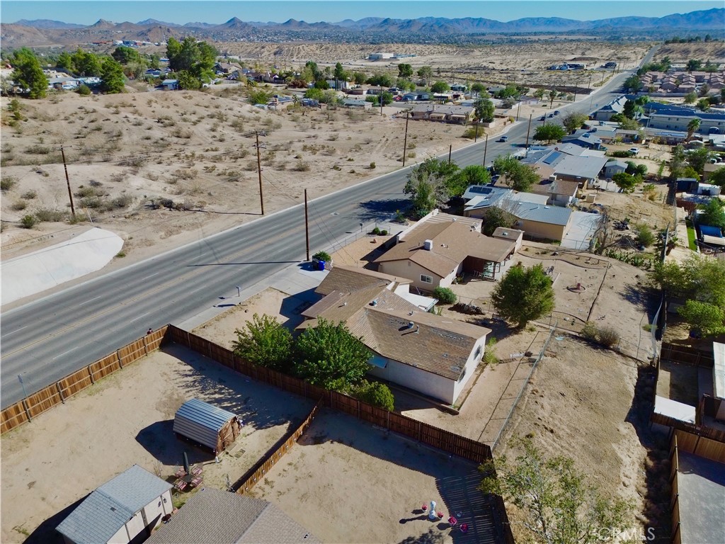 16403 Seneca Road Victorville, CA 92395 - Photo 36 of 47 an aerial view of a house with a yard