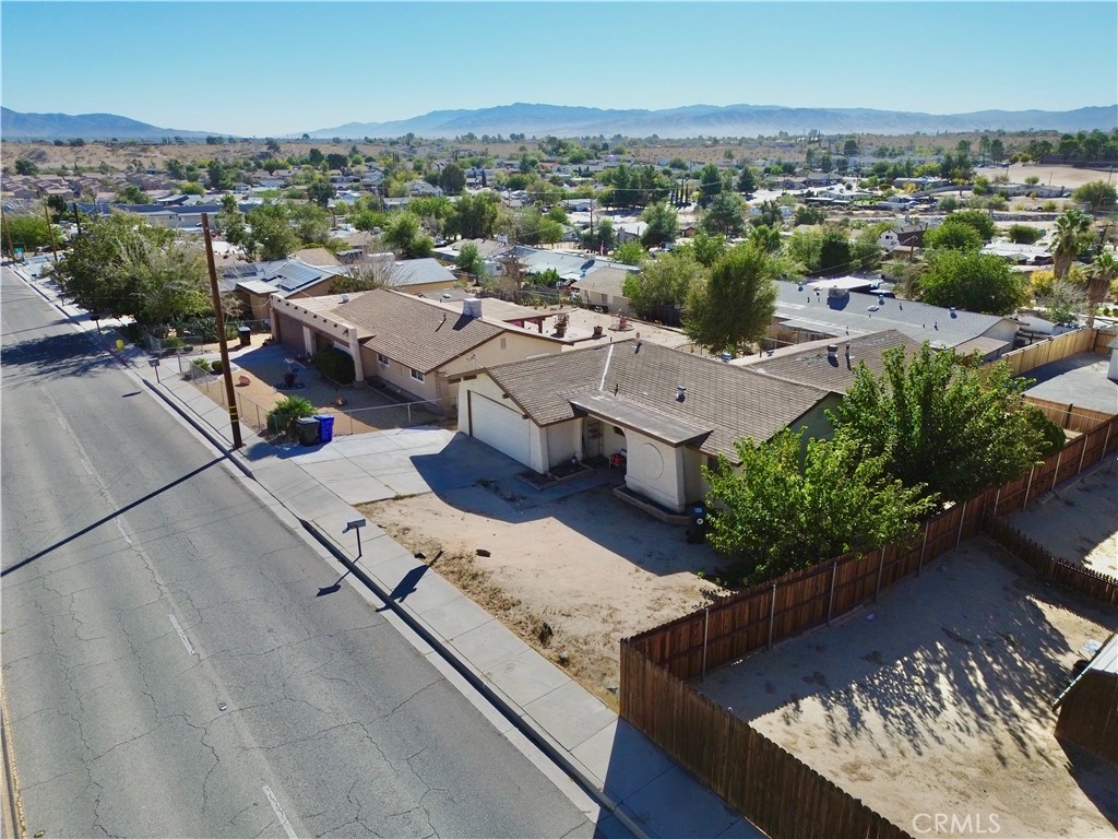 16403 Seneca Road Victorville, CA 92395 - Photo 38 of 47 an aerial view of a house with garden space and ocean view