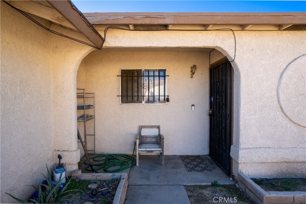 16403 Seneca Road Victorville, CA 92395 - Photo 4 of 47 a view of a door and chair in the house