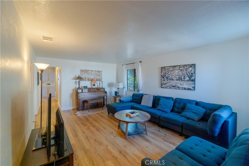 16403 Seneca Road Victorville, CA 92395 - Photo 6 of 47 a living room with furniture and a couch
