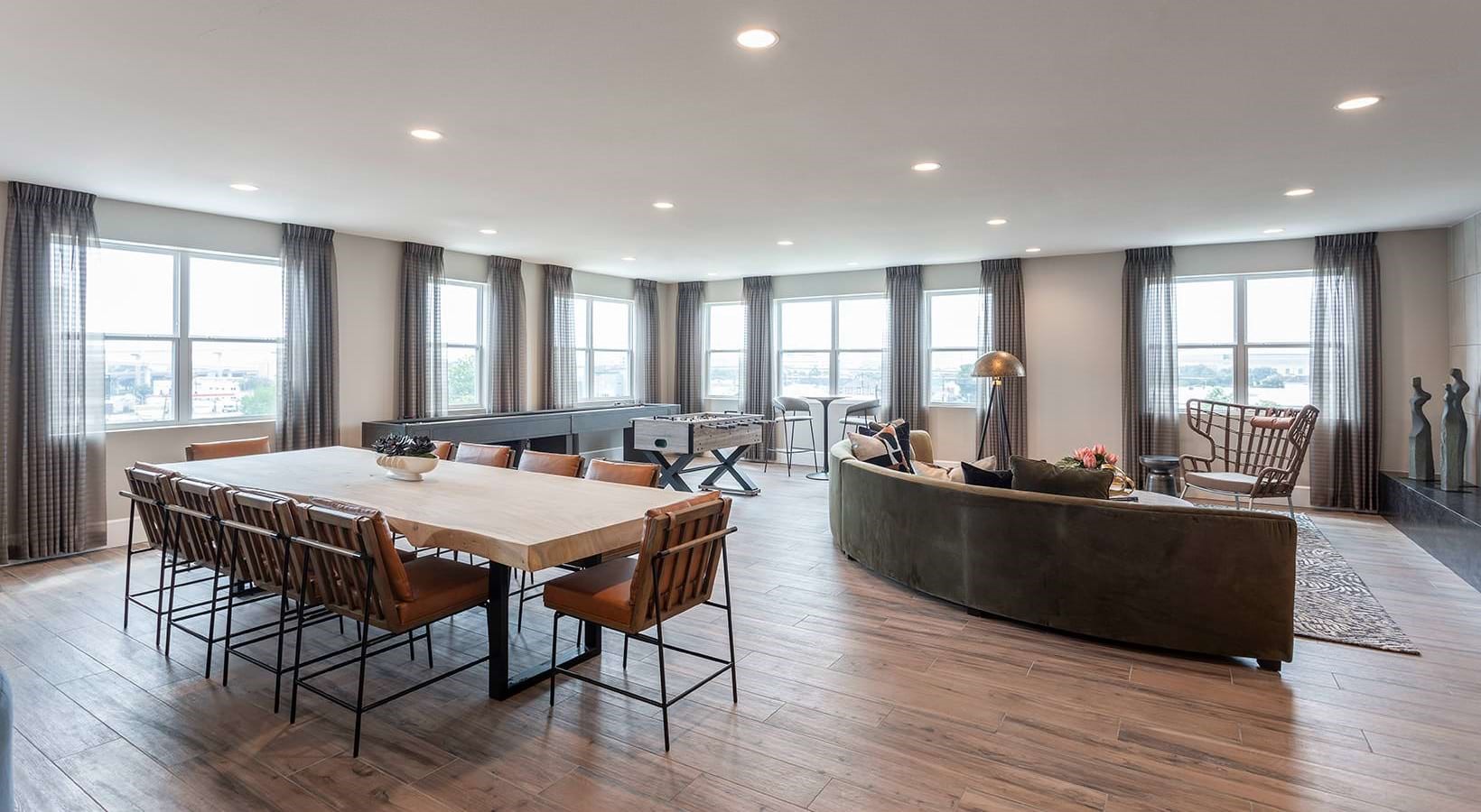 2425 Bell Street, Unit 1227 Houston, TX 77003 - Photo 28 of 30 a large dining space with furniture window and wooden floor