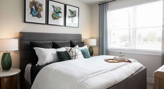 a bedroom with a bed and a window