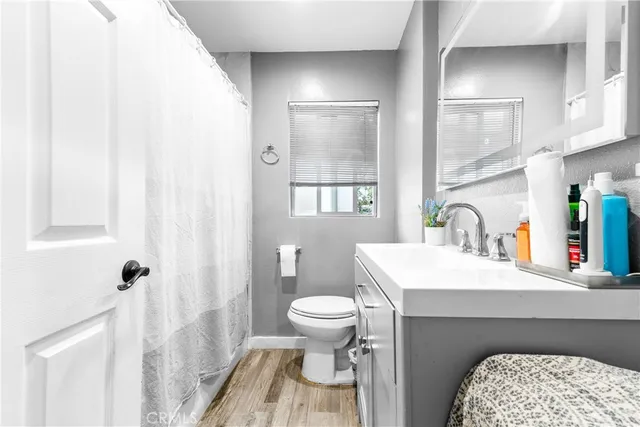 a en suite bathroom with a sink toilet and a mirror
