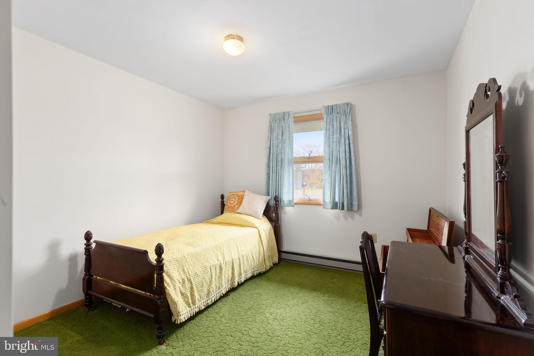 201 Arlene Street Minersville, PA 17954 - Photo 21 of 31 a bedroom with a bed table chair and a window