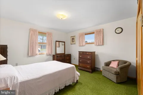 a bedroom with a bed and furniture