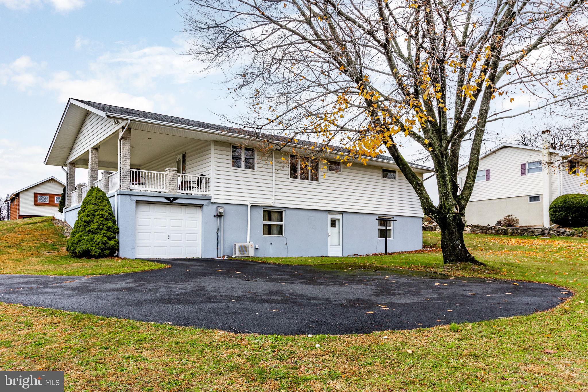 201 Arlene Street Minersville, PA 17954 - Photo 29 of 31 a view of a white house with a large tree