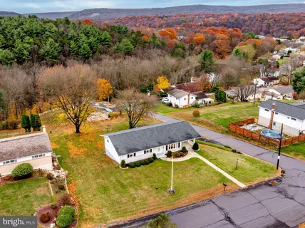 a view of a swimming pool with a lake view