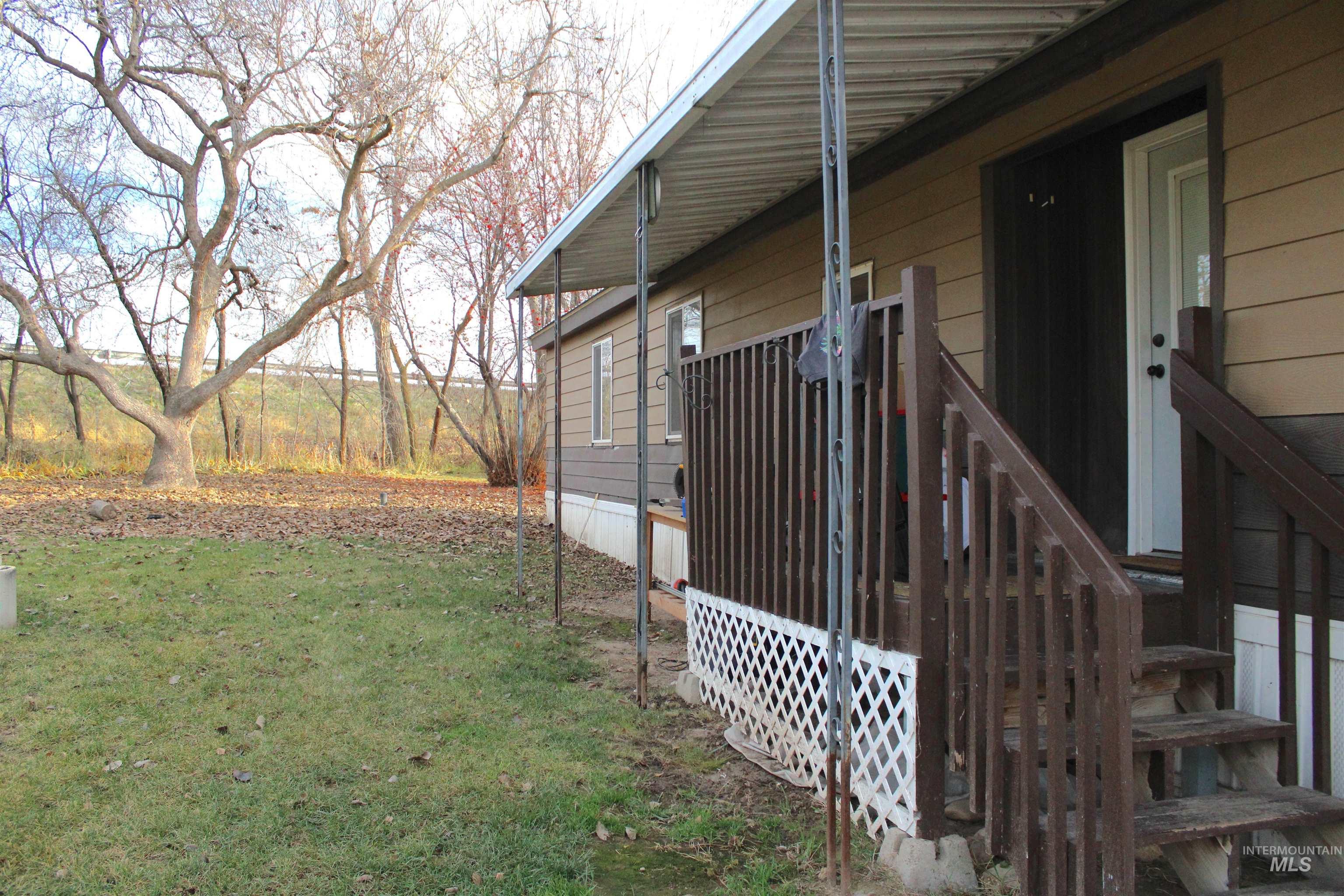 15881 Purple Sage Road, Unit 3 Caldwell, ID 83607 - Photo 1 of 1 View of side of home with a yard