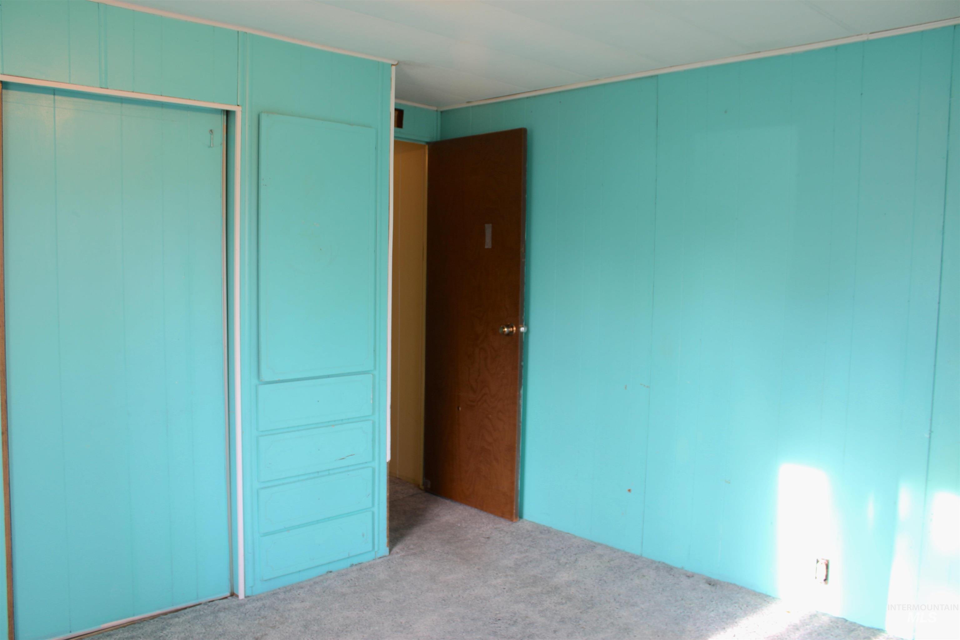 15881 Purple Sage Road, Unit 3 Caldwell, ID 83607 - Photo 18 of 29 Unfurnished bedroom featuring a closet and carpet