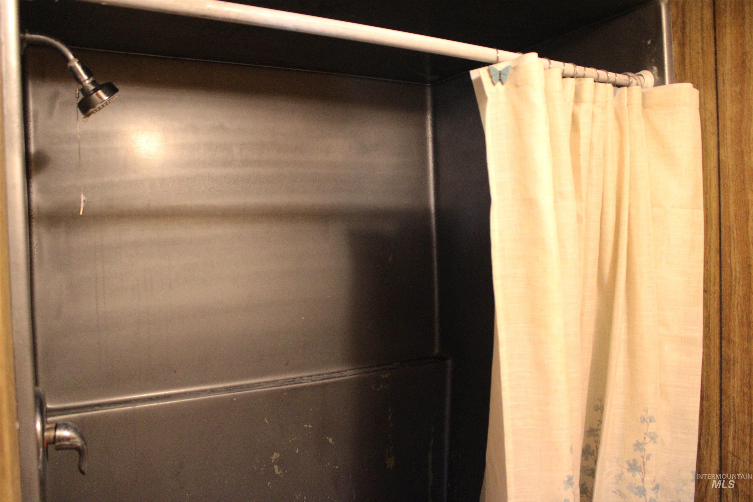 15881 Purple Sage Road, Unit 3 Caldwell, ID 83607 - Photo 23 of 29 Bathroom view of a shower with shower curtain and elevator