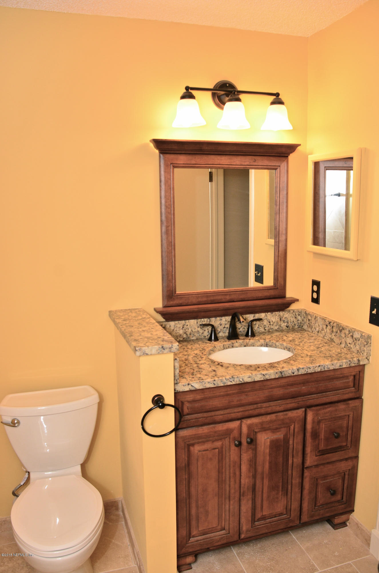 405 Tournament Road Ponte Vedra, FL 32082 - Photo 14 of 31 a bathroom with a granite countertop toilet sink and mirror