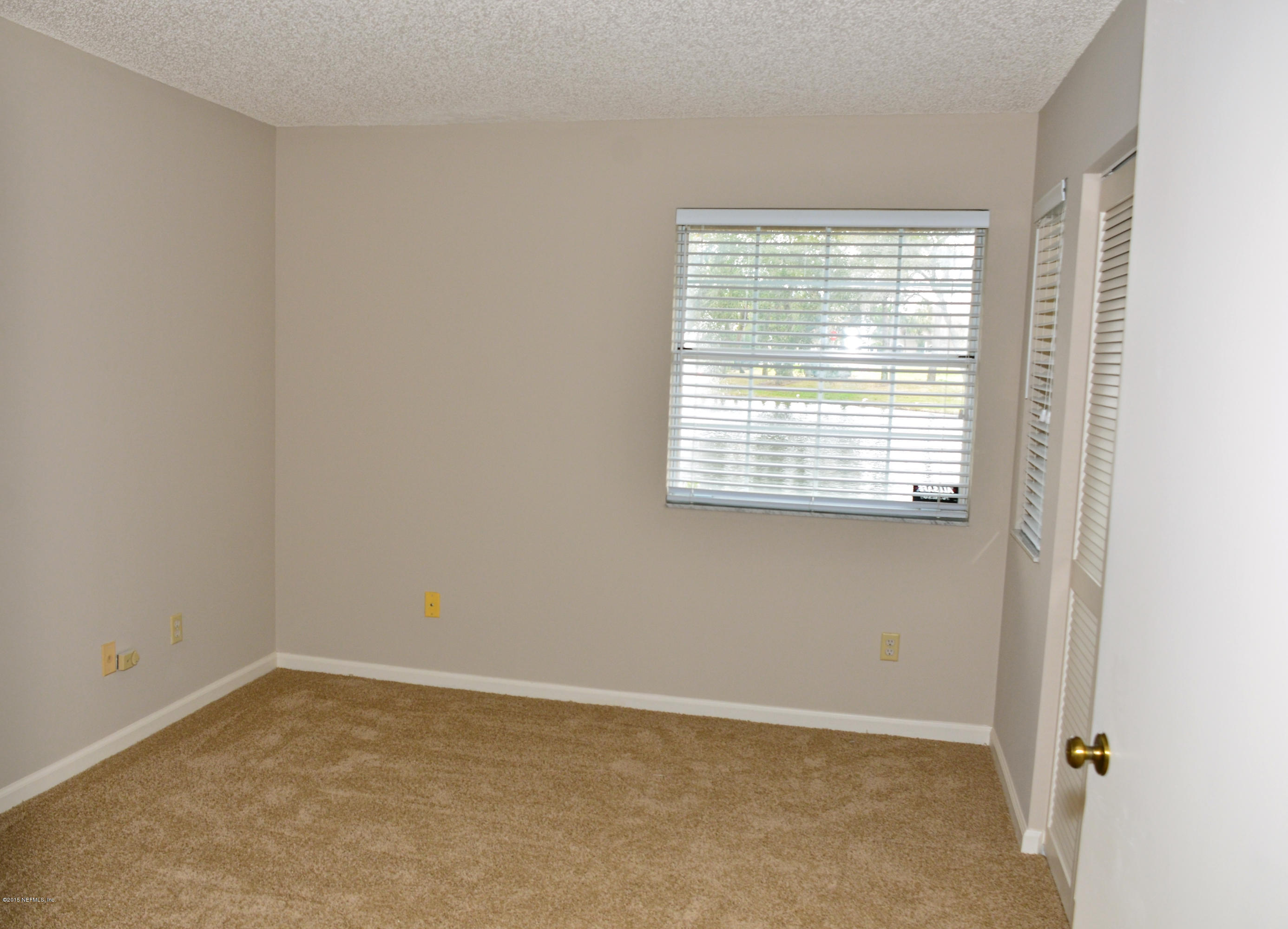 405 Tournament Road Ponte Vedra, FL 32082 - Photo 23 of 31 a view of an empty room with a window