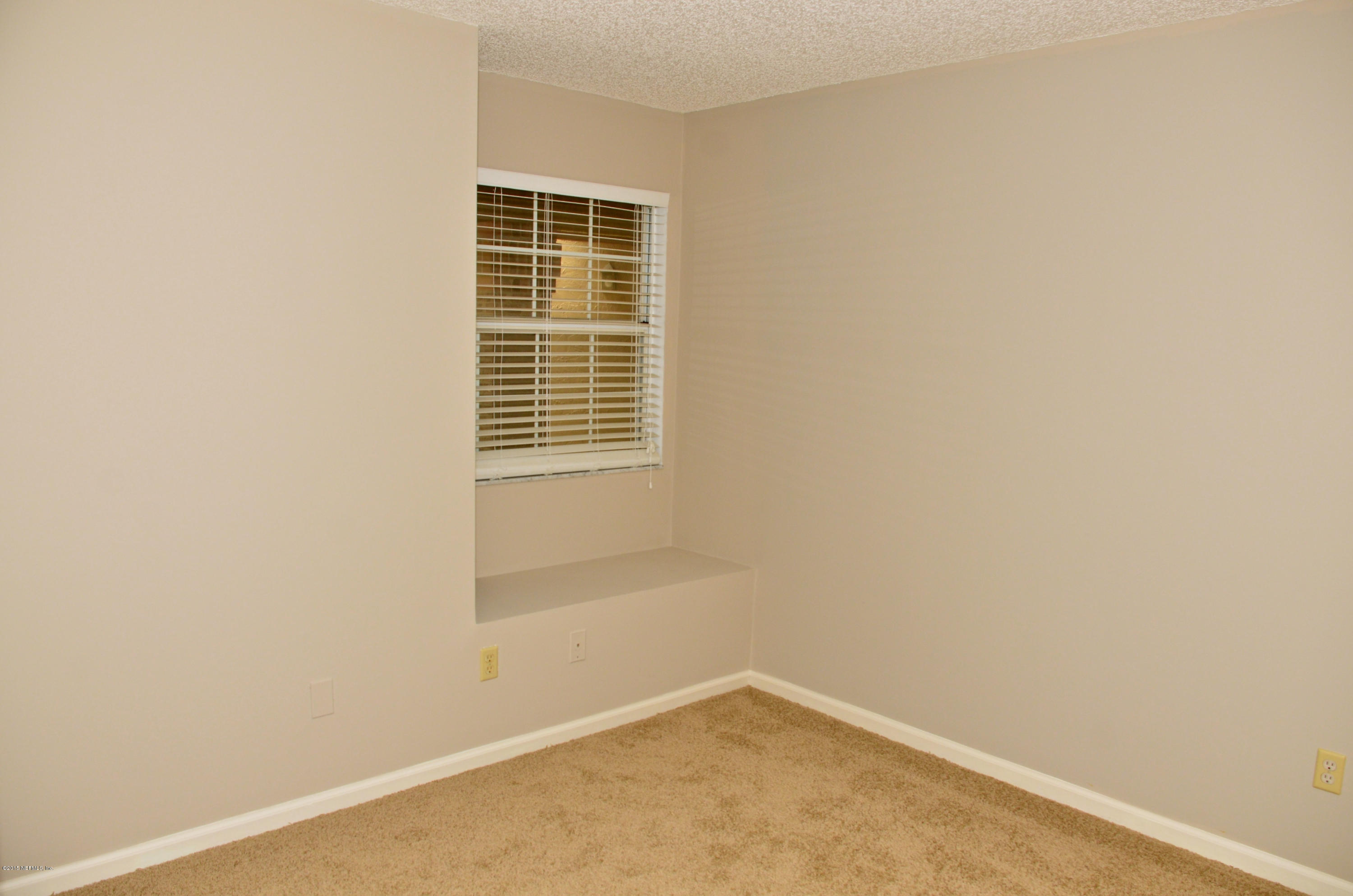 405 Tournament Road Ponte Vedra, FL 32082 - Photo 24 of 31 a view of an empty room with a window