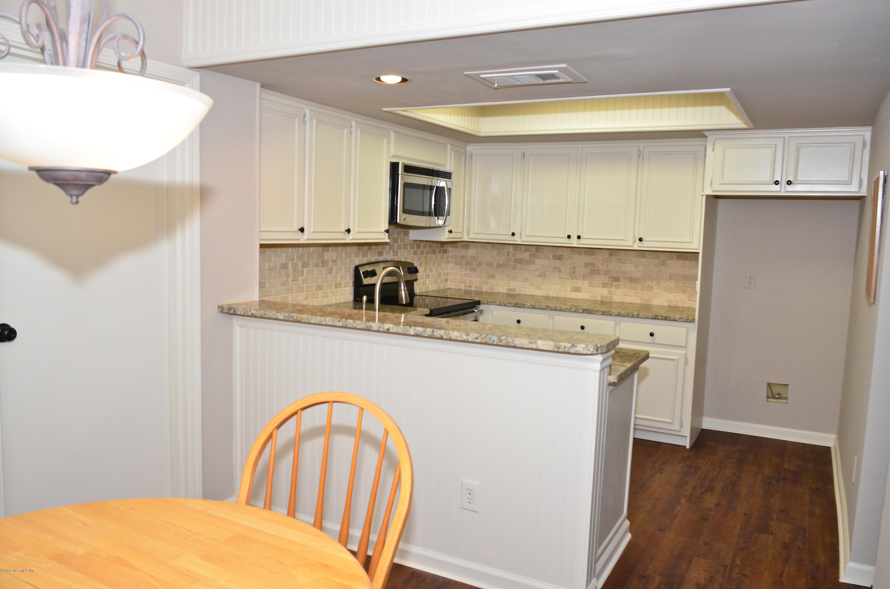 405 Tournament Road Ponte Vedra, FL 32082 - Photo 8 of 31 a kitchen with stainless steel appliances granite countertop a stove a sink dishwasher and a refrigerator with wooden floor