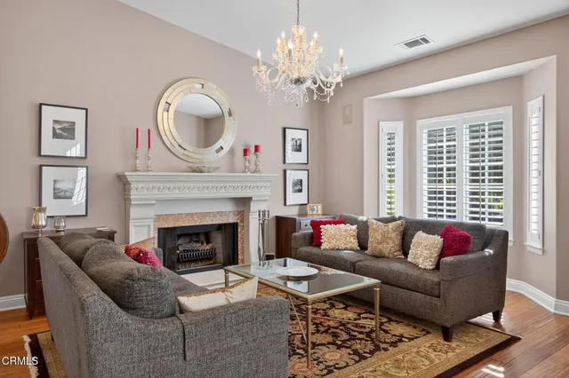 a view of a dining room with furniture and chandelier