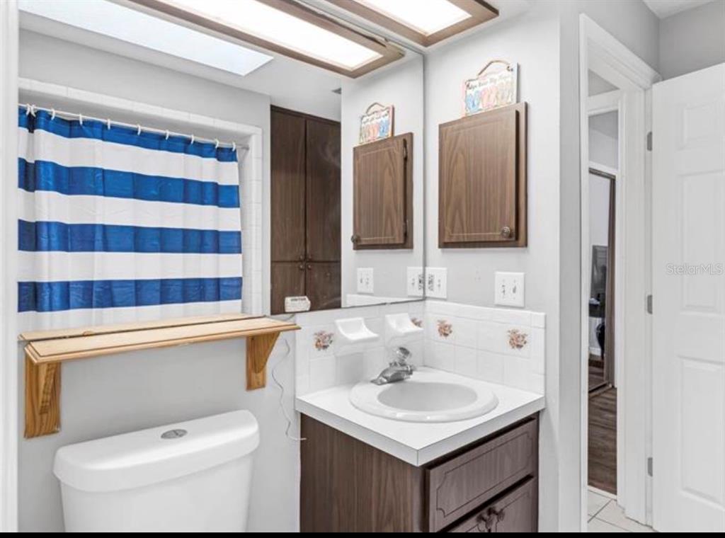 4308 Allen Road Fruitland Park, FL 34731 - Photo 23 of 33 a bathroom with a sink toilet and shower