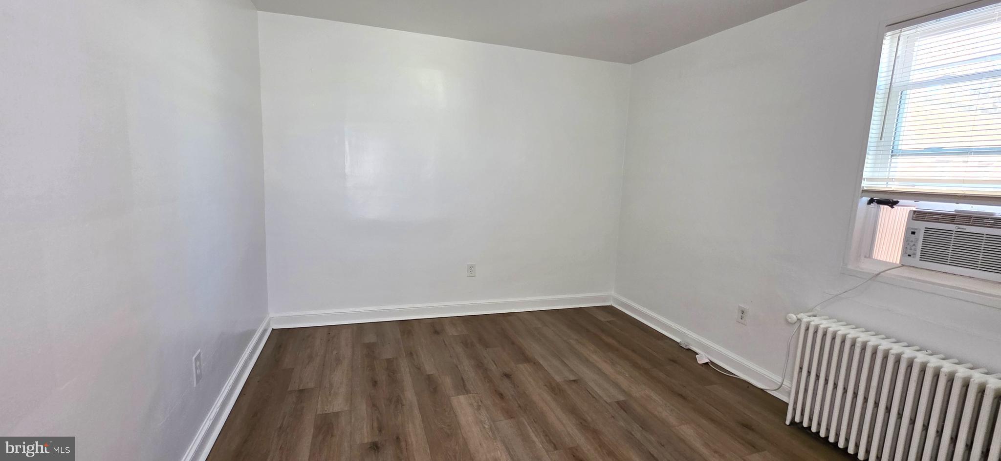 3207 11th Place Southeast, Unit 4 Washington, DC 20032 - Photo 11 of 16 a view of a room with wooden floor and a window
