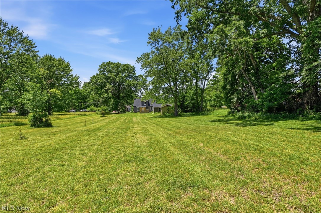 951 Bey Road Akron, OH 44312 - Photo 34 of 34 Expansive green lawn with mature trees providing a natural perimeter