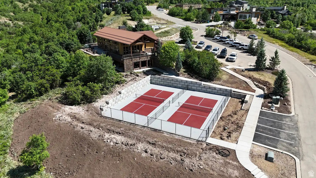 70 West Cougar Run Salem, UT 84653 - Photo 3 of 7 Two red-surfaced pickleball courts enclosed by fencing and a concrete retaining wall