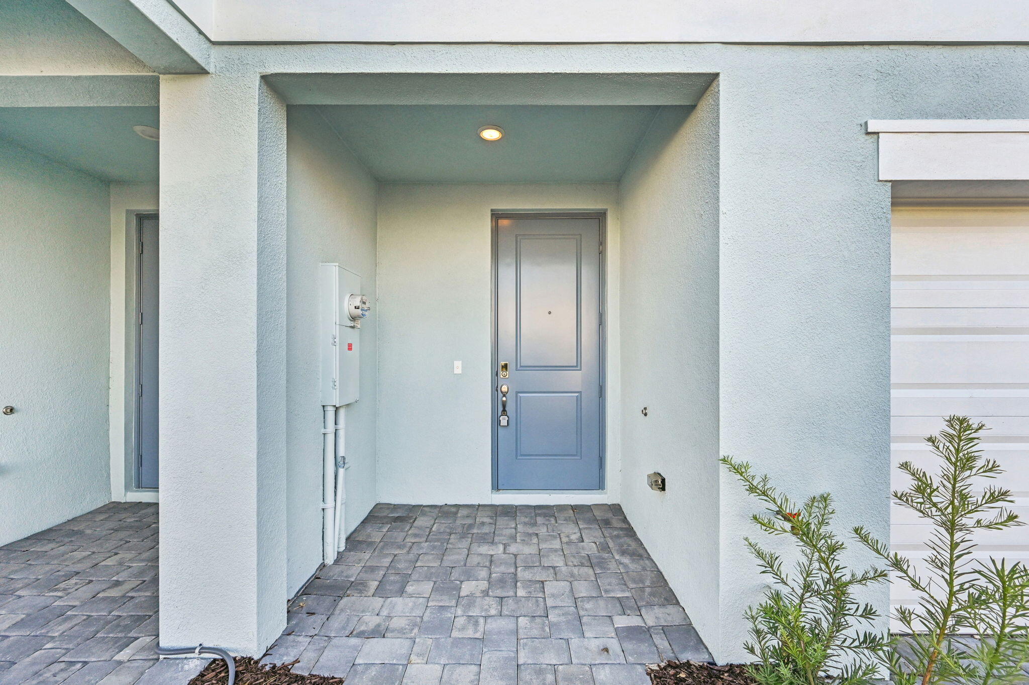 458 Salisbury Circle Fort Pierce, FL 34982 - Photo 4 of 32 a view of a hallway with wooden floor and a bathroom