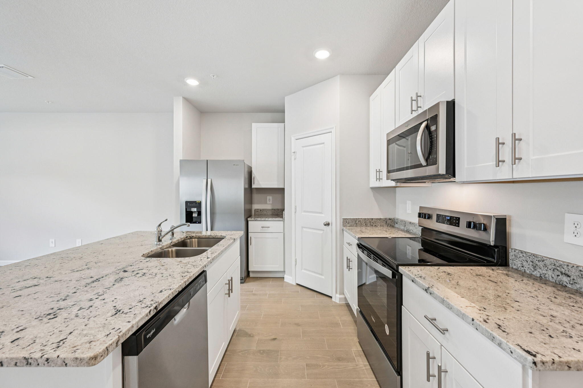 458 Salisbury Circle Fort Pierce, FL 34982 - Photo 8 of 32 a kitchen with stainless steel appliances granite countertop a sink stove and refrigerator