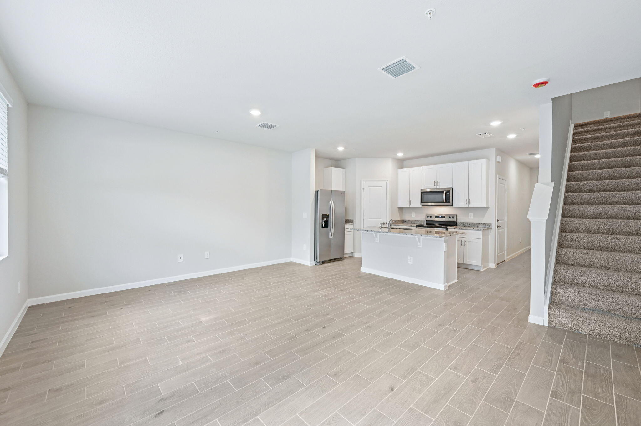 458 Salisbury Circle Fort Pierce, FL 34982 - Photo 9 of 32 a view of kitchen with wooden floor and electronic appliances