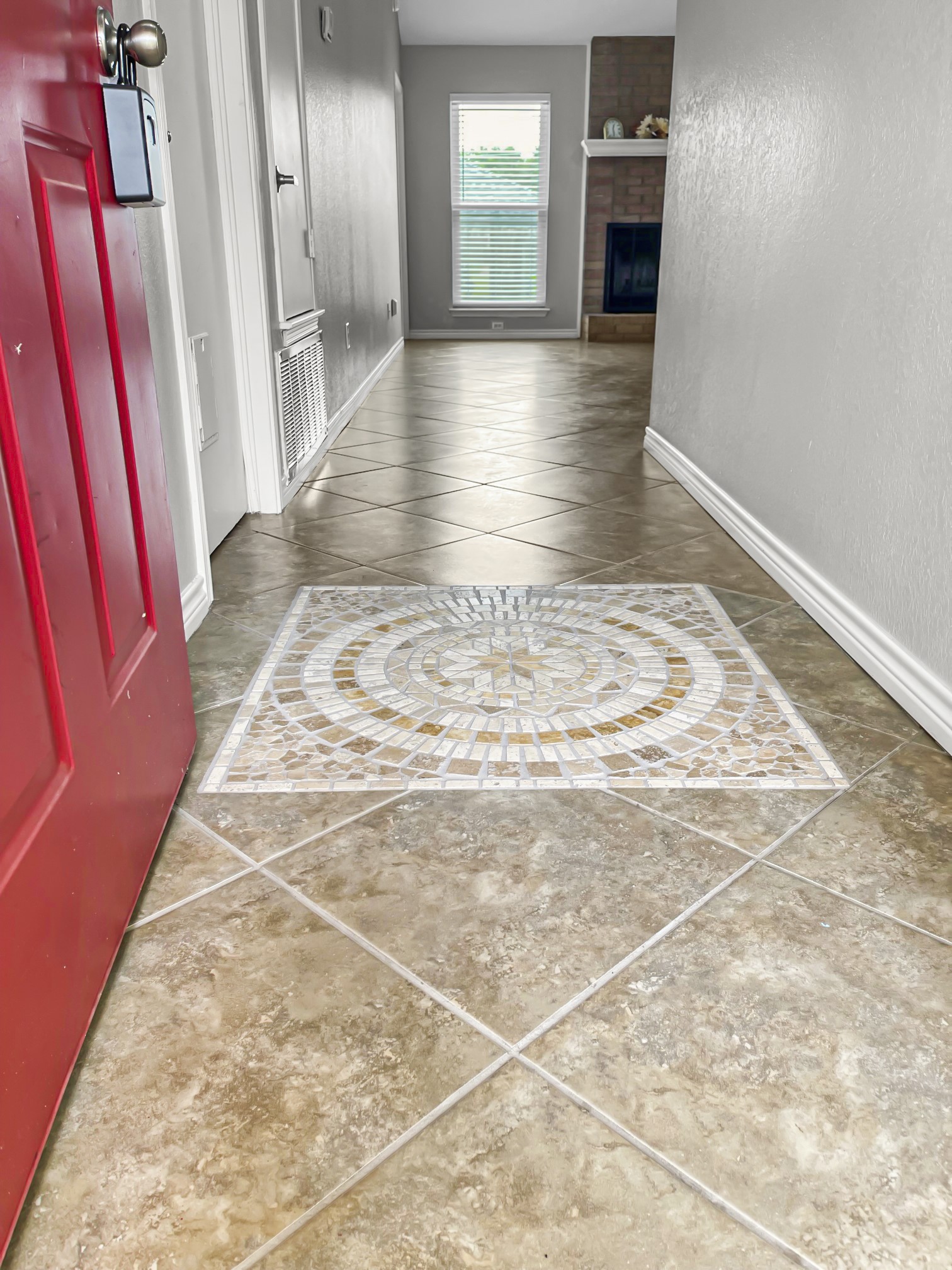 4701 High Pointe Drive Temple, TX 76502 - Photo 2 of 9 Corridor featuring tile patterned flooring, inlaid floor details, and a textured wall