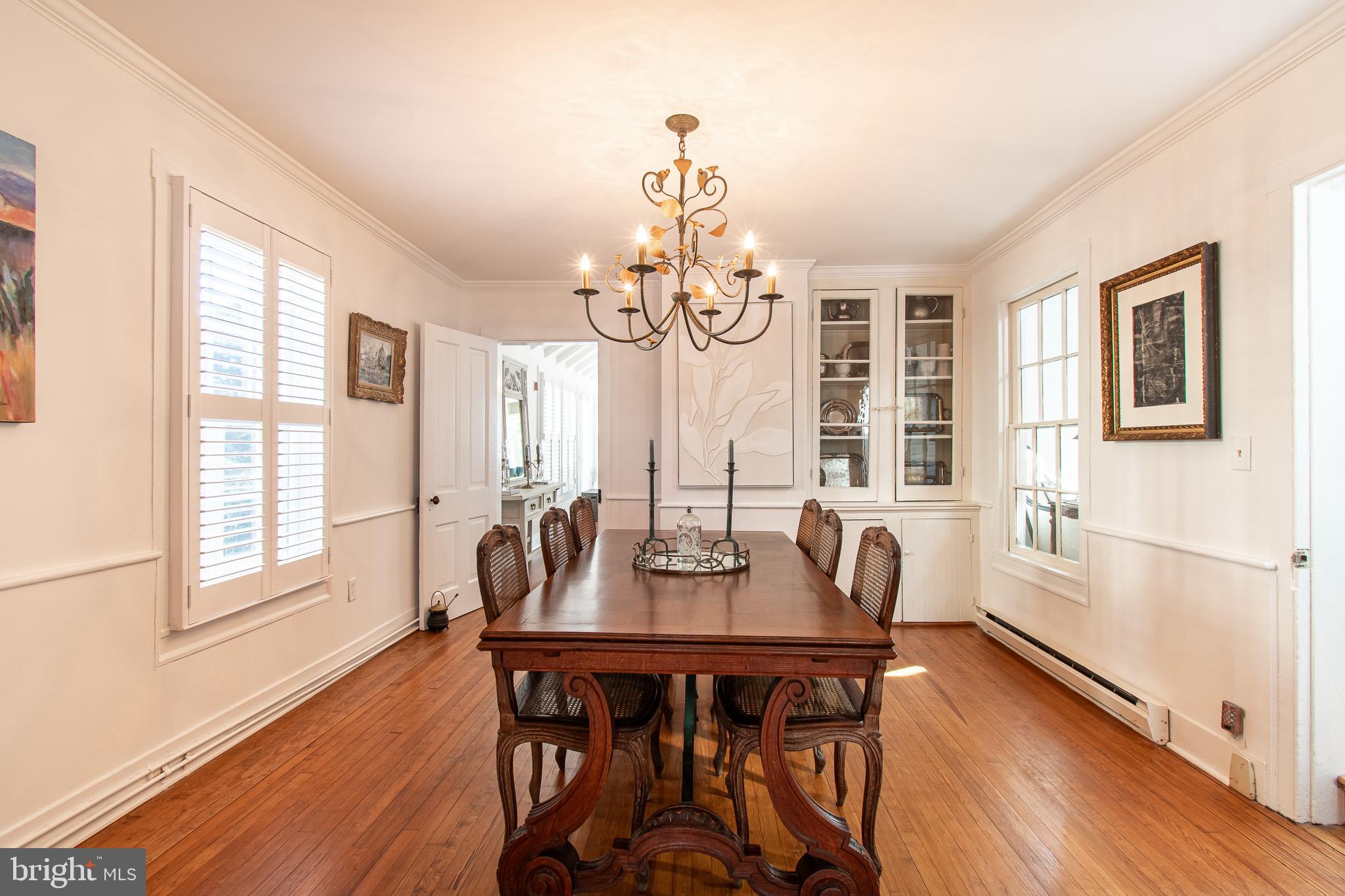 114 East Chew Avenue St. Michaels, MD 21663 - Photo 12 of 57 a view of a dining room with furniture windows and wooden floor