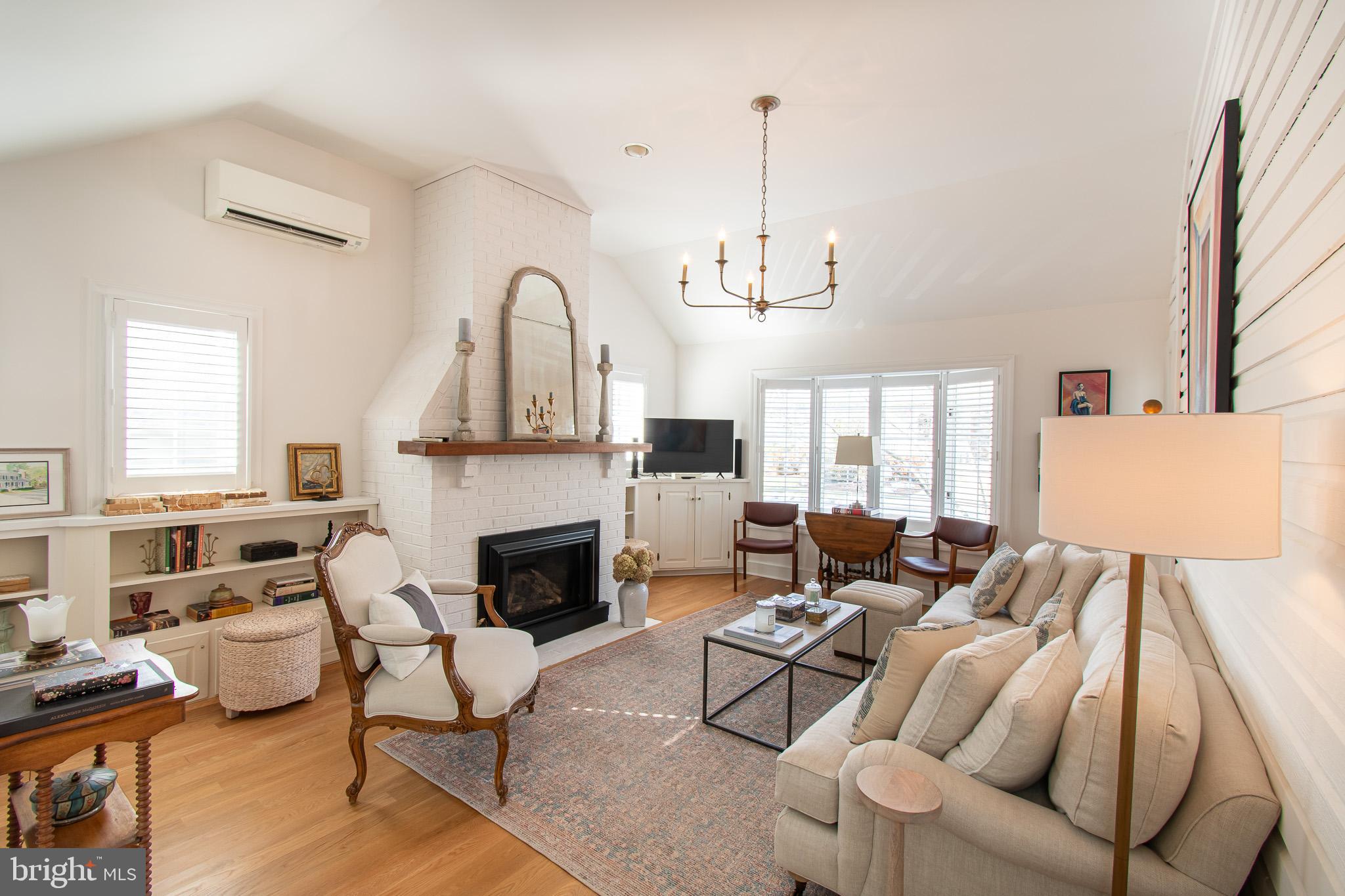 114 East Chew Avenue St. Michaels, MD 21663 - Photo 20 of 57 a living room with furniture and a fireplace