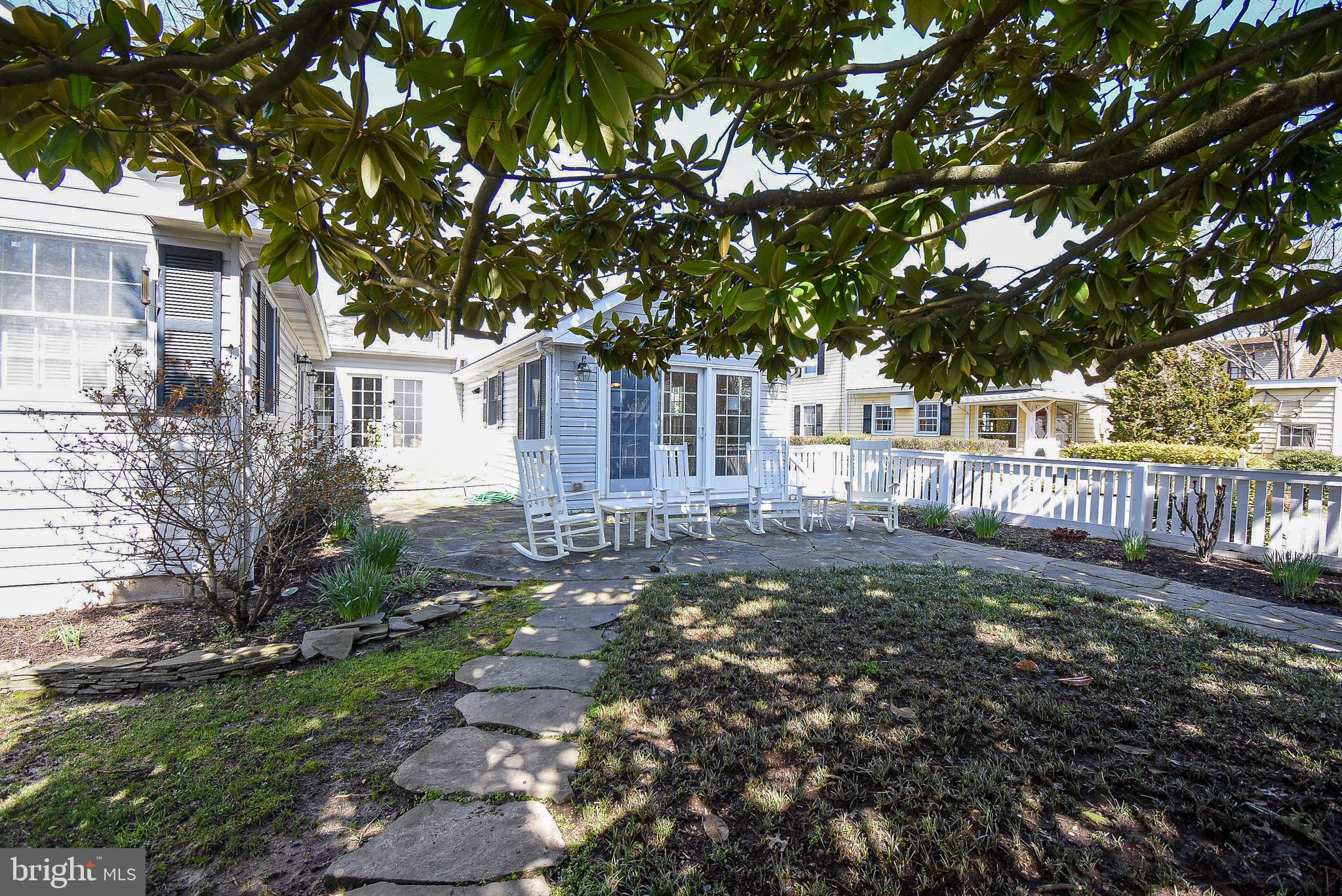 114 East Chew Avenue St. Michaels, MD 21663 - Photo 35 of 57 a view of a house with a small yard and plants