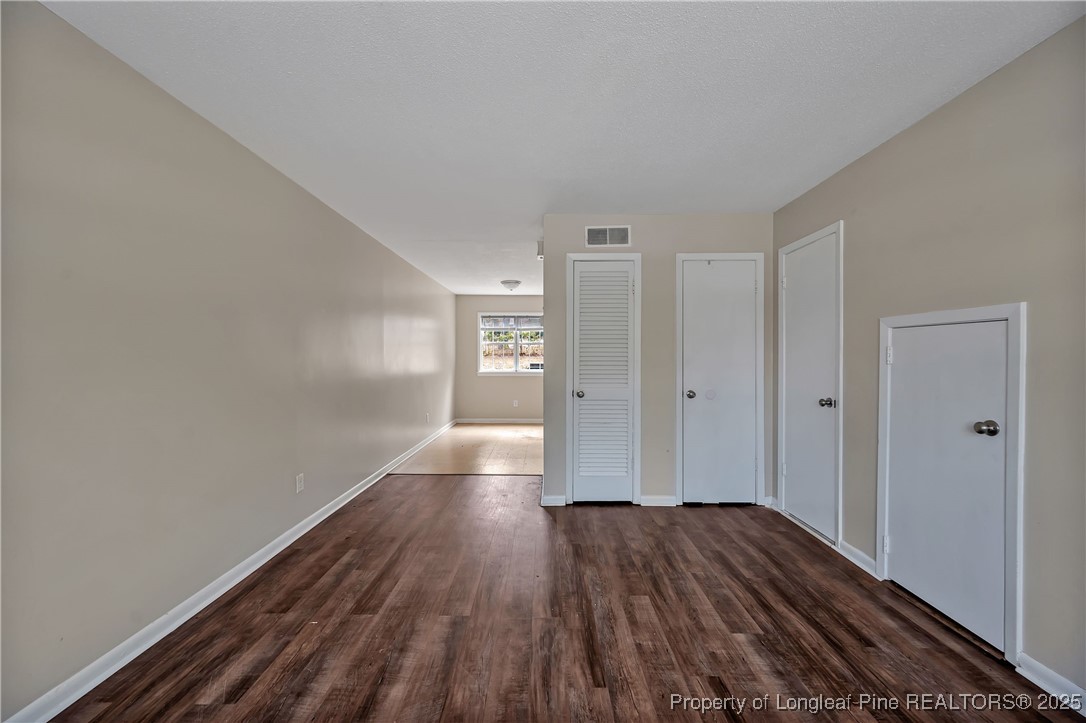 302 Law Road, Unit A Fayetteville, NC 28311 - Photo 5 of 8 a view of hallway with wooden floor