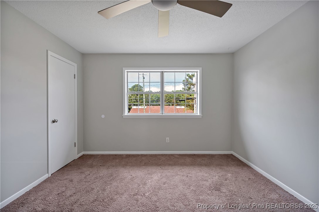 302 Law Road, Unit A Fayetteville, NC 28311 - Photo 6 of 8 an empty room with a window