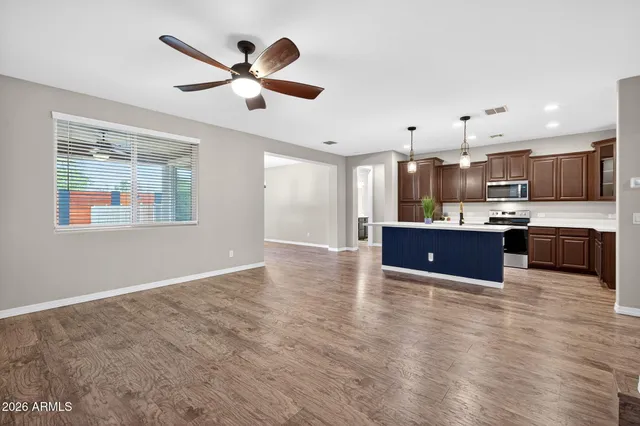a large kitchen with cabinets and stainless steel appliances