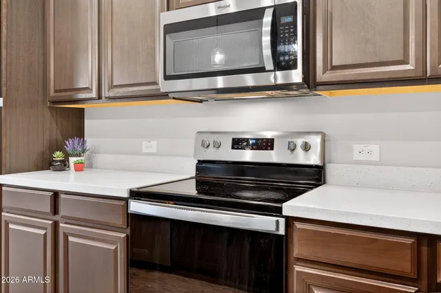 a kitchen with a stove and a microwave