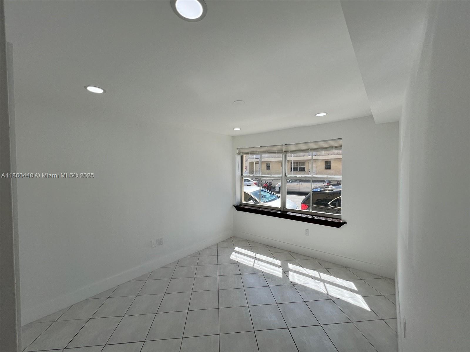 1308 Drexel Avenue, Unit 103 Miami Beach, FL 33139 - Photo 25 of 37 a view of a room with window