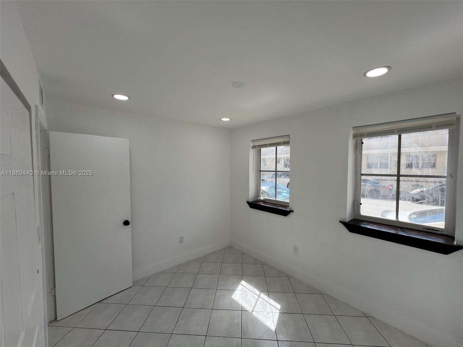 1308 Drexel Avenue, Unit 103 Miami Beach, FL 33139 - Photo 29 of 37 a view of an empty room with a window