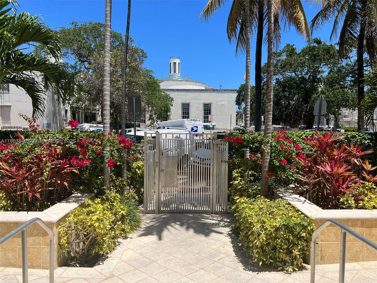 1308 Drexel Avenue, Unit 103 Miami Beach, FL 33139 - Photo 7 of 37 a view of a house with a tree and flower garden