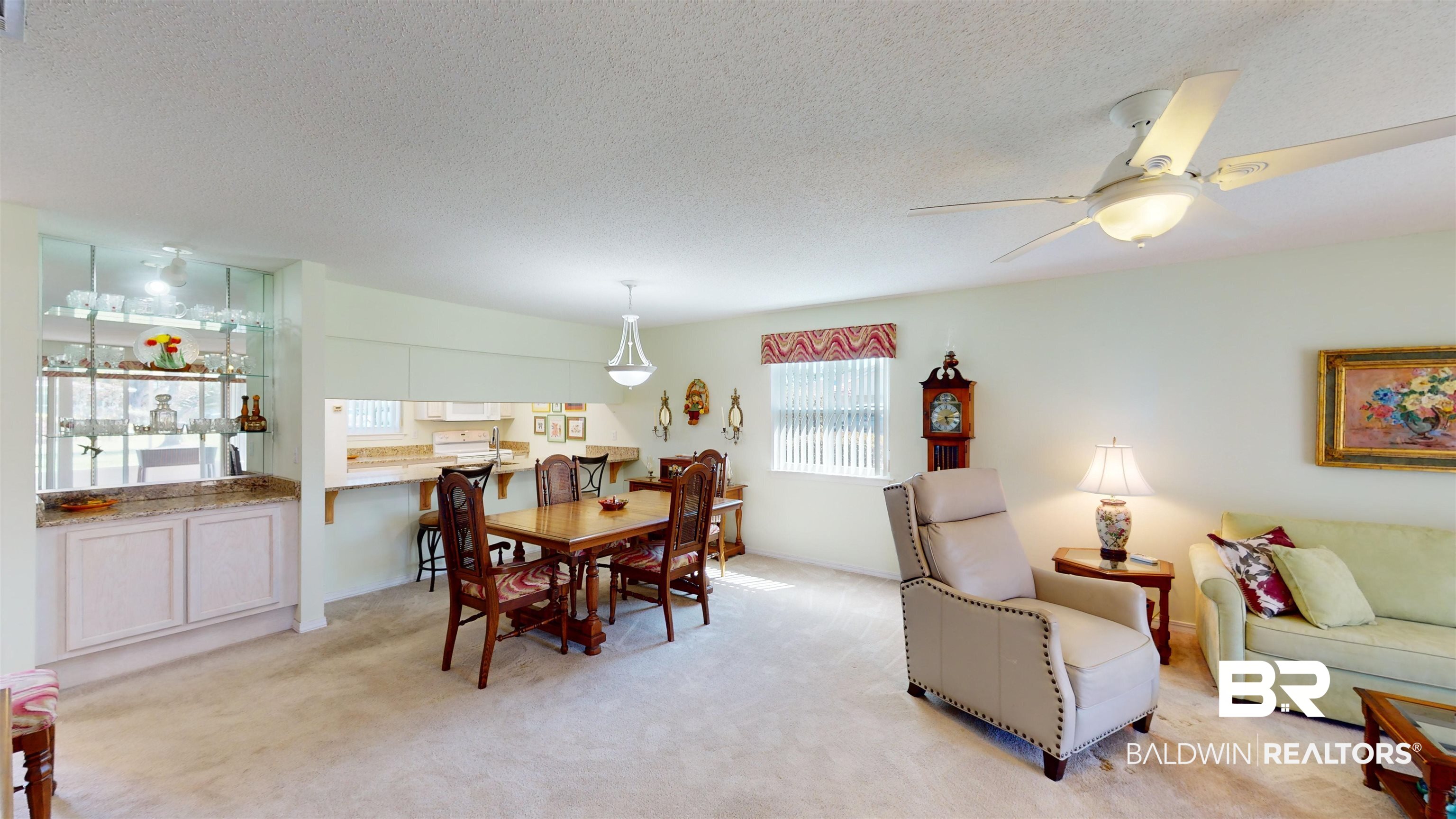 9445 Villas Drive Foley, AL 36535 - Photo 8 of 20 Carpeted dining room featuring ceiling fan and a textured ceiling