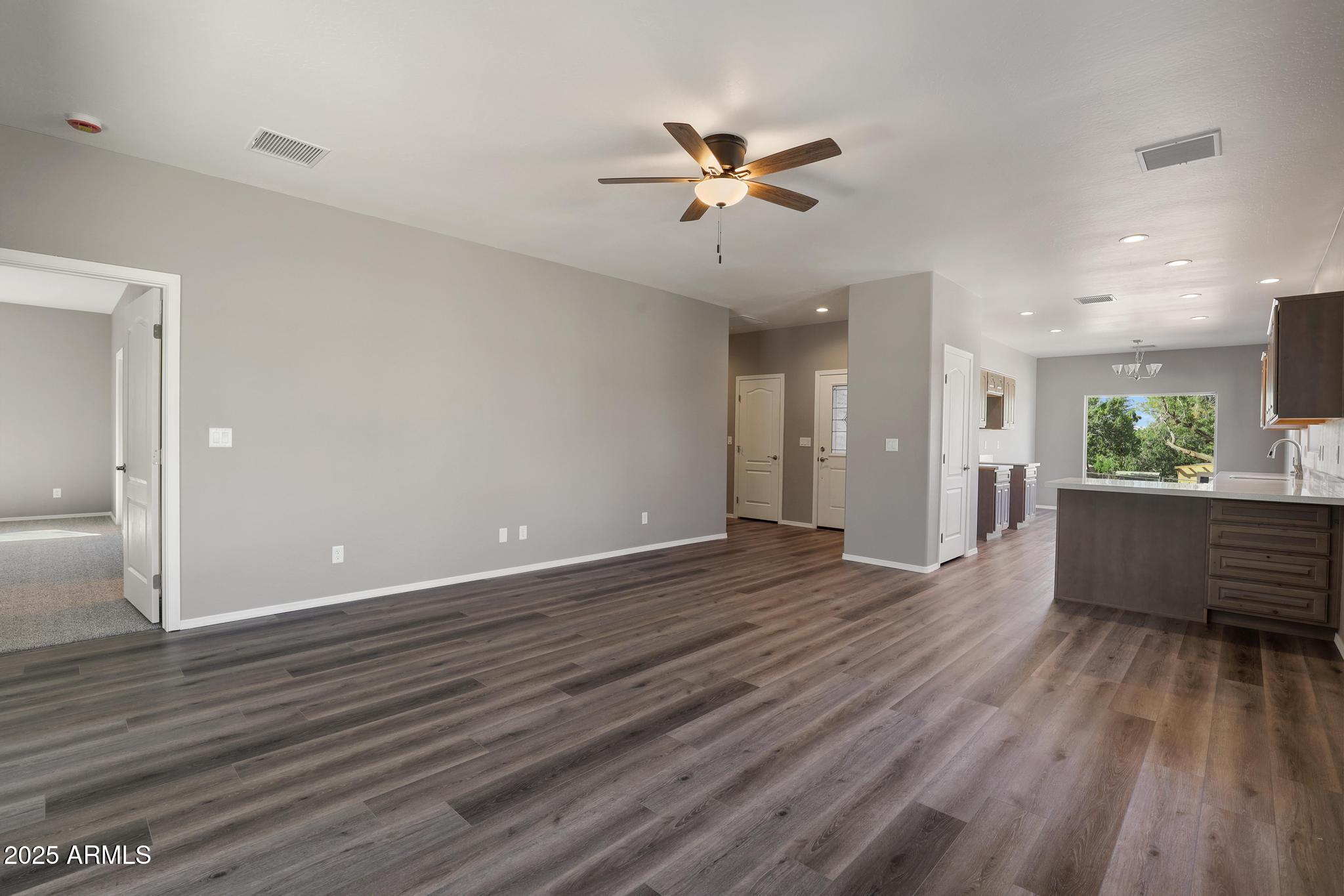 1019 South Ponderosa Street Payson, AZ 85541 - Photo 4 of 34 a view of an empty room and wooden floor