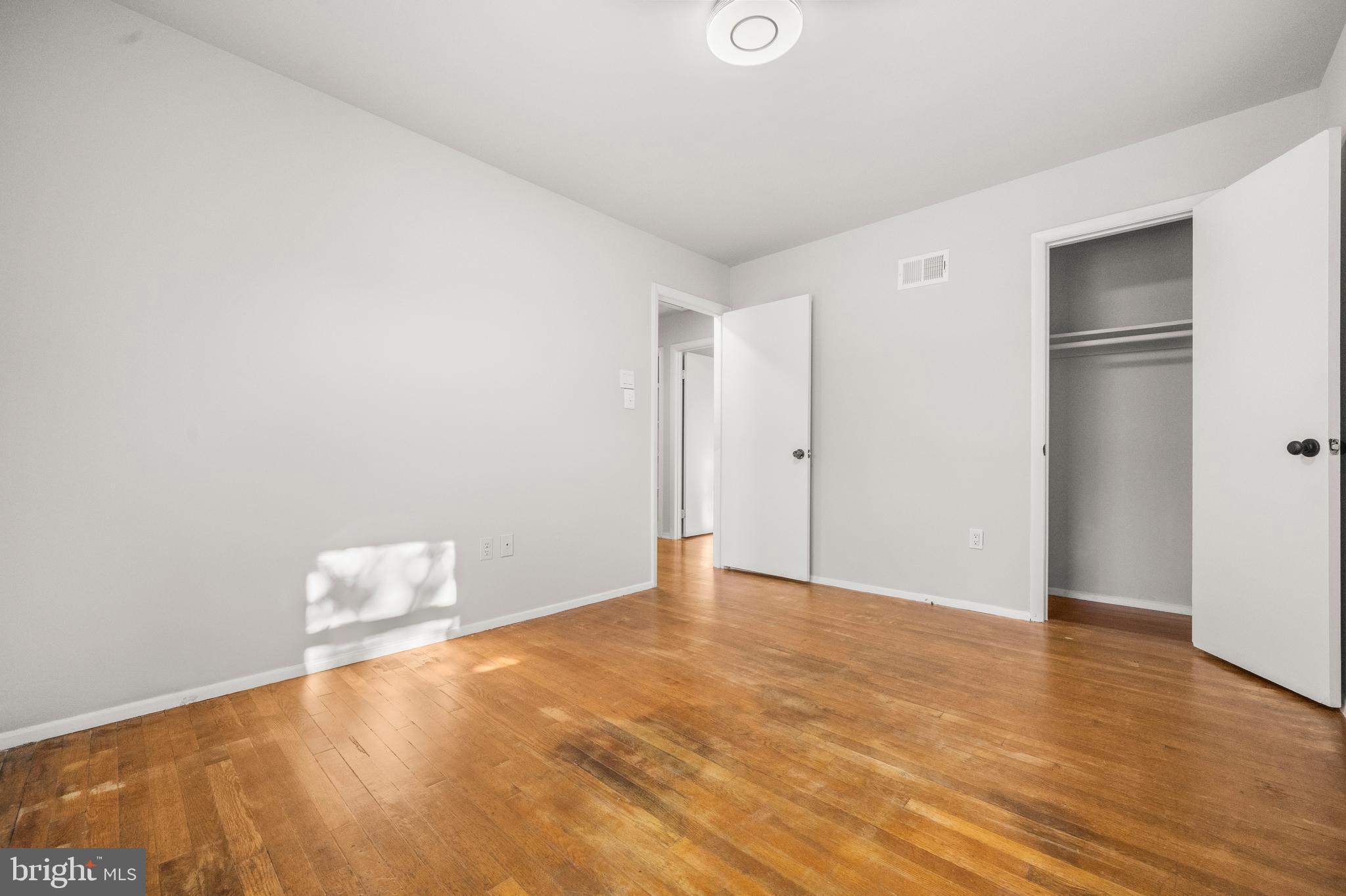 13411 Kerrydale Road Woodbridge, VA 22193 - Photo 20 of 44 a view of an empty room with wooden floor