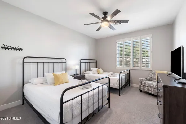 a bedroom with furniture and window