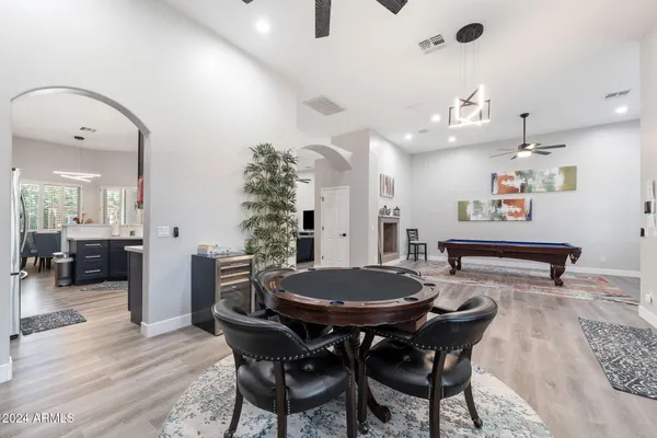 a outdoor dining space with furniture and wooden floor